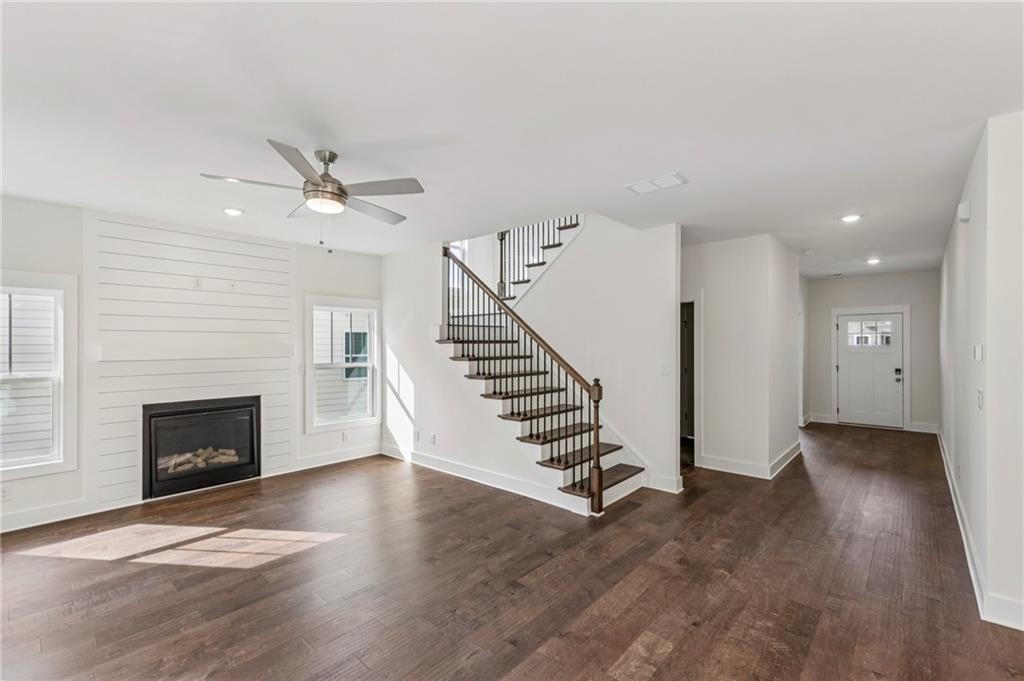 2637 Mills Bend Decatur, GA 30034 - Photo 4 of 14 an empty room with wooden floor fireplace and windows