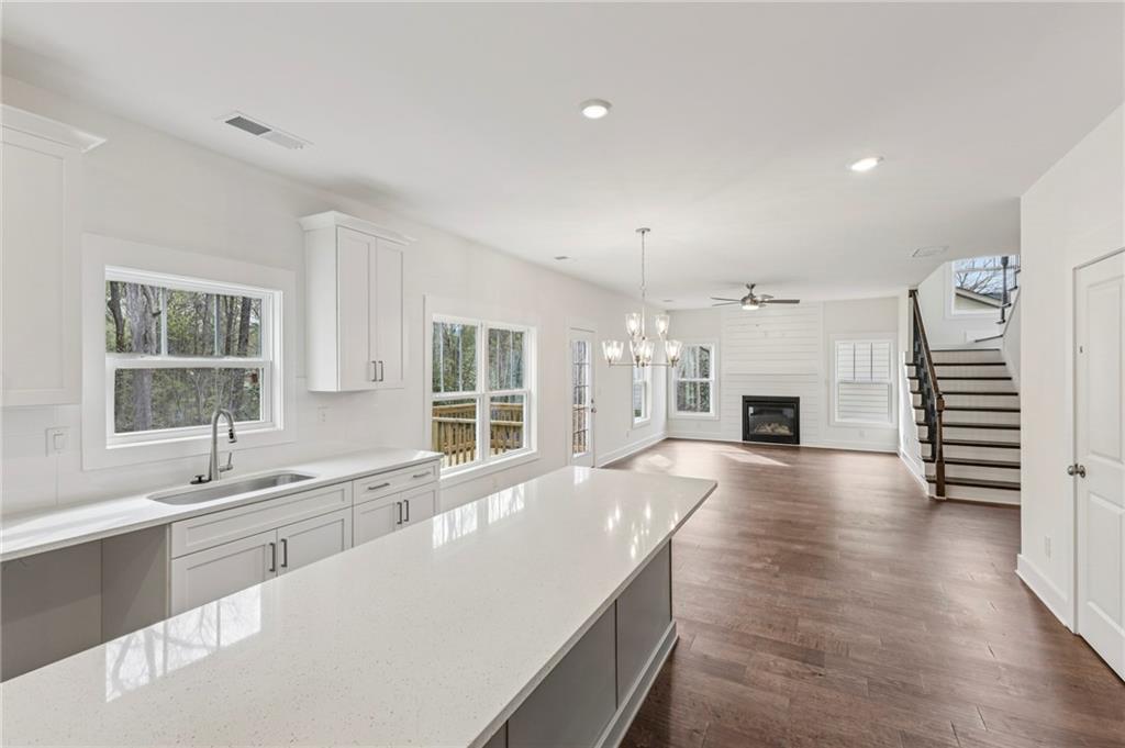 2637 Mills Bend Decatur, GA 30034 - Photo 7 of 14 a large white kitchen with a large window and stainless steel appliances