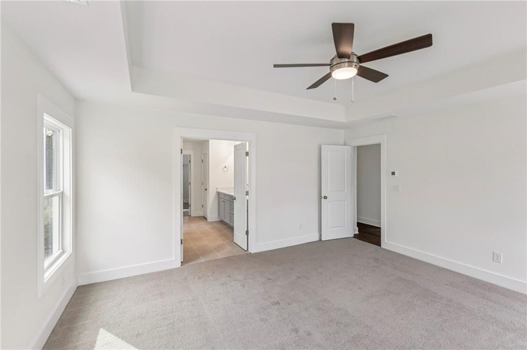 2637 Mills Bend Decatur, GA 30034 - Photo 10 of 14 a view of a livingroom with a ceiling fan & windows