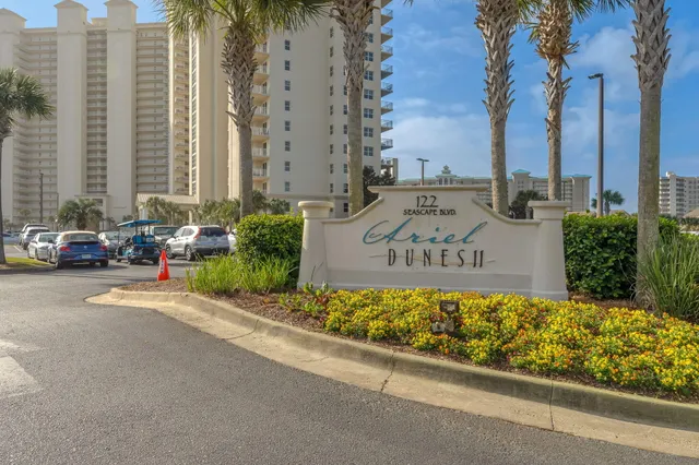 a view of a balcony with table and chairs