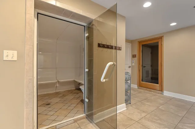 a view of a room with rack on the wall and a window