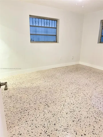 a bedroom with a bed and a walk in closet