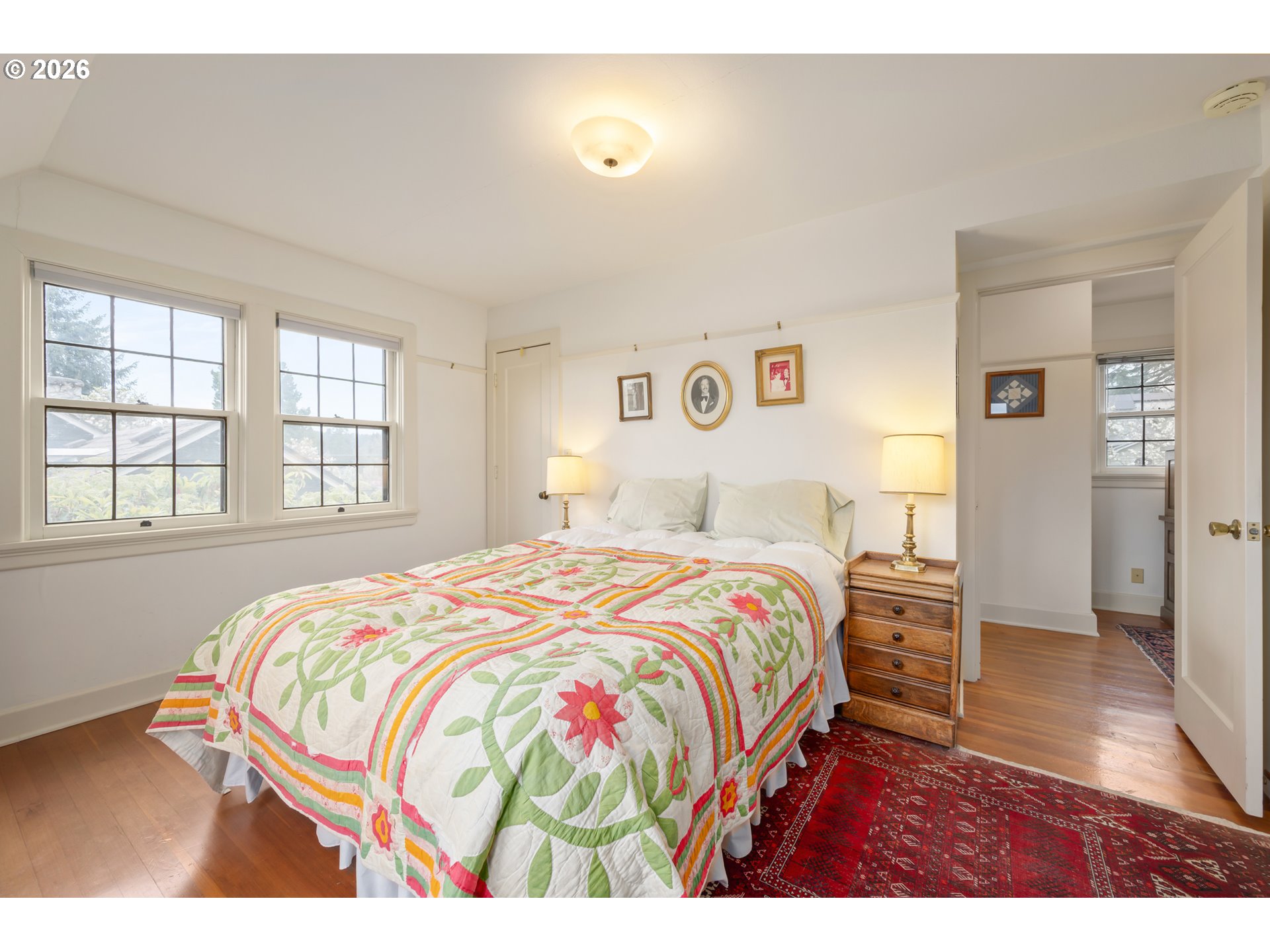2223 Olive Street Eugene, OR 97405 - Photo 16 of 44 a bedroom with a bed and wooden floor