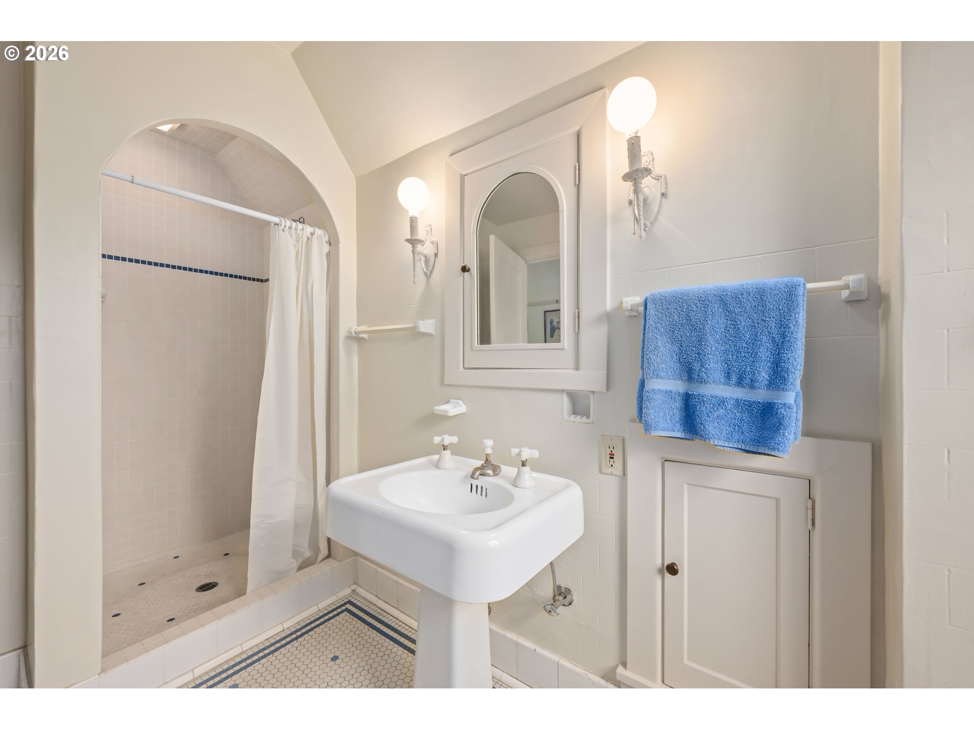 2223 Olive Street Eugene, OR 97405 - Photo 18 of 44 a bathroom with a sink a mirror and a shower