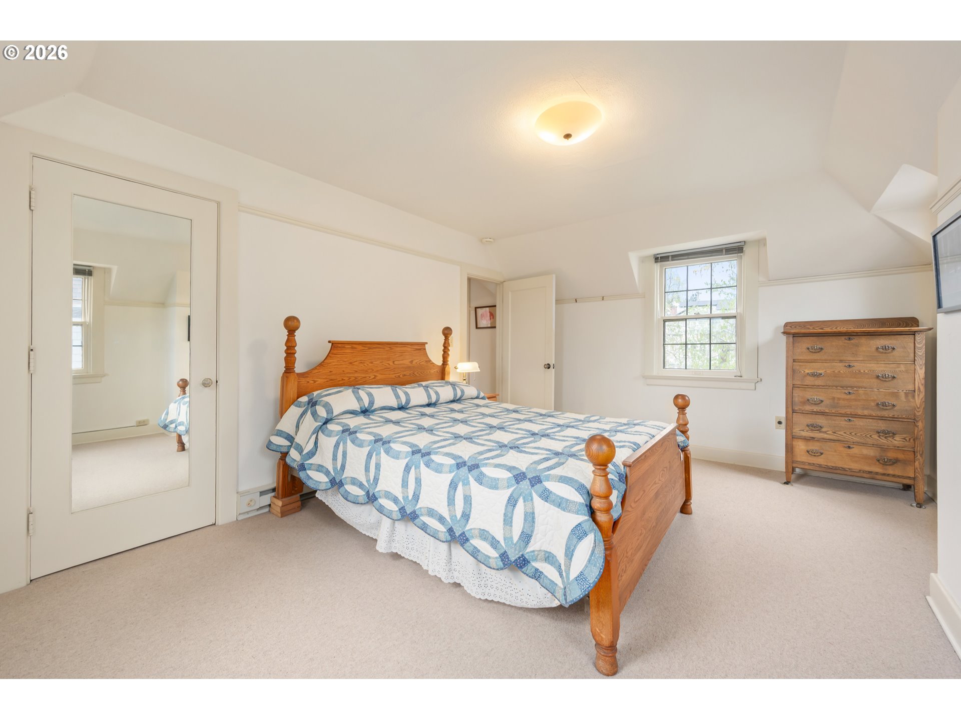 2223 Olive Street Eugene, OR 97405 - Photo 20 of 44 a bedroom with a bed and wooden floor