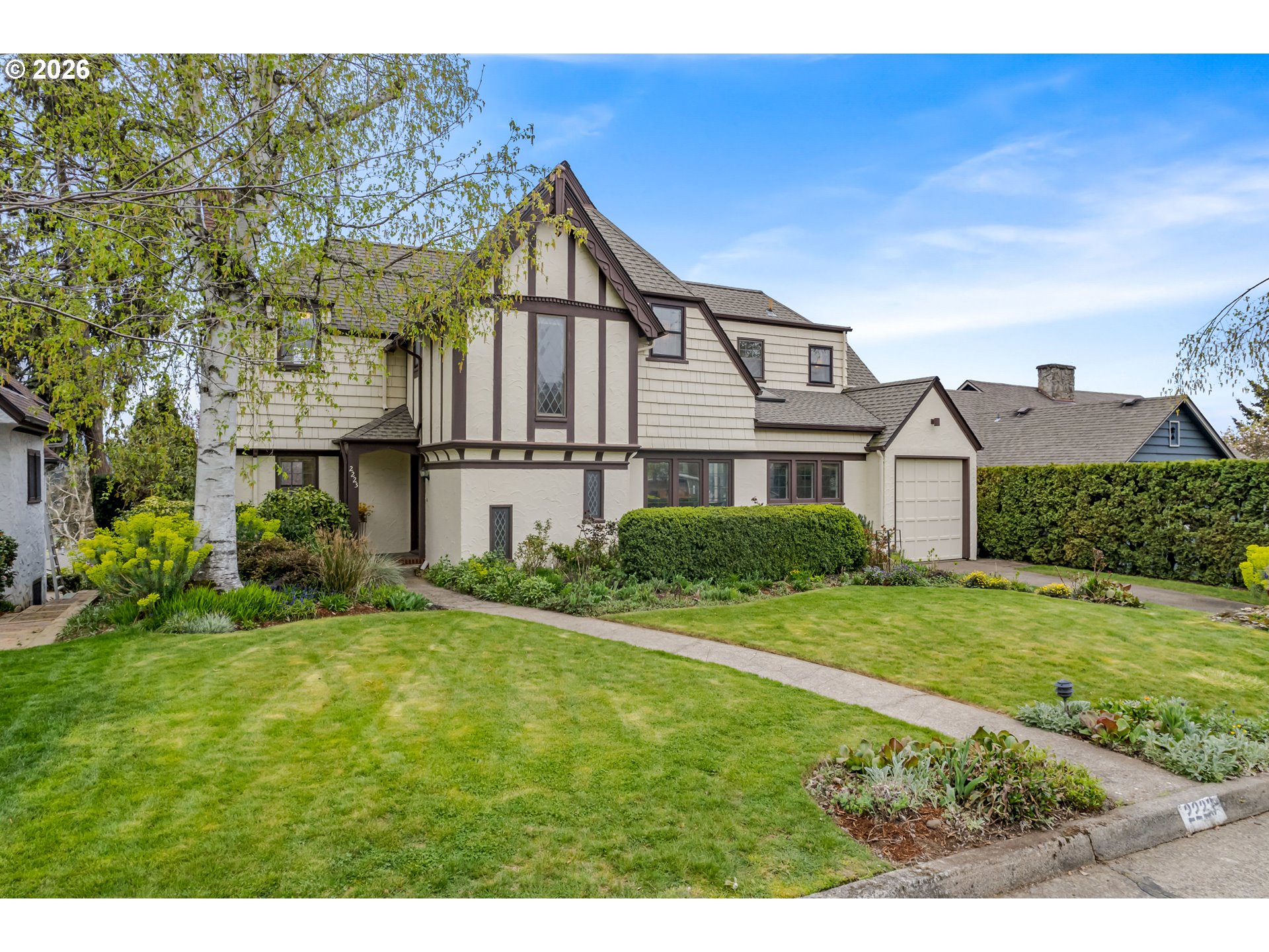 2223 Olive Street Eugene, OR 97405 - Photo 2 of 44 a front view of a house with a yard