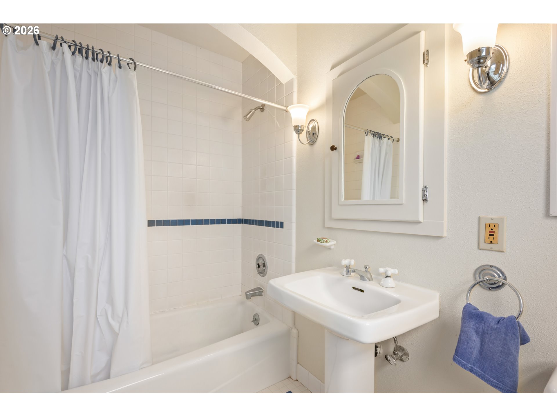 2223 Olive Street Eugene, OR 97405 - Photo 25 of 44 a bathroom with a sink mirror and a shower