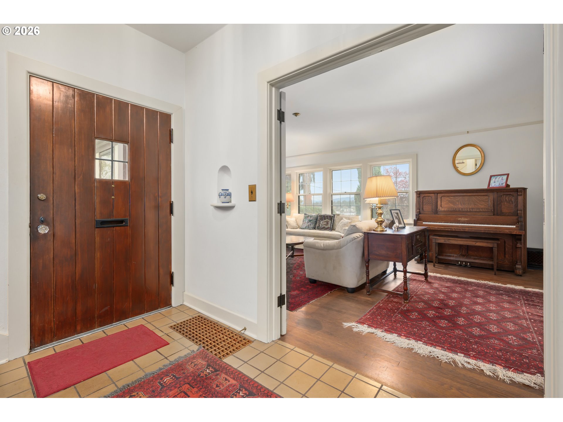 2223 Olive Street Eugene, OR 97405 - Photo 3 of 44 a living room with furniture a clock on wall and a table