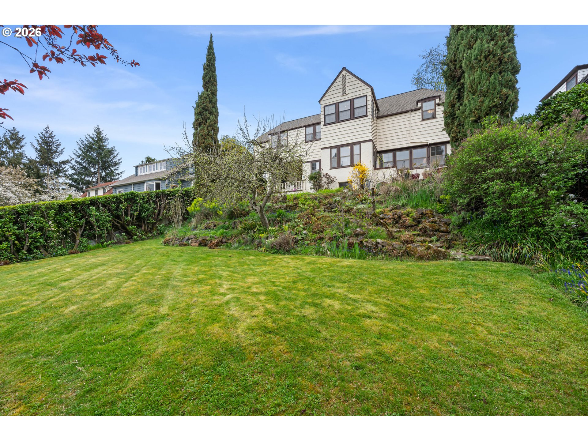2223 Olive Street Eugene, OR 97405 - Photo 34 of 44 a view of a large garden with plants and large trees
