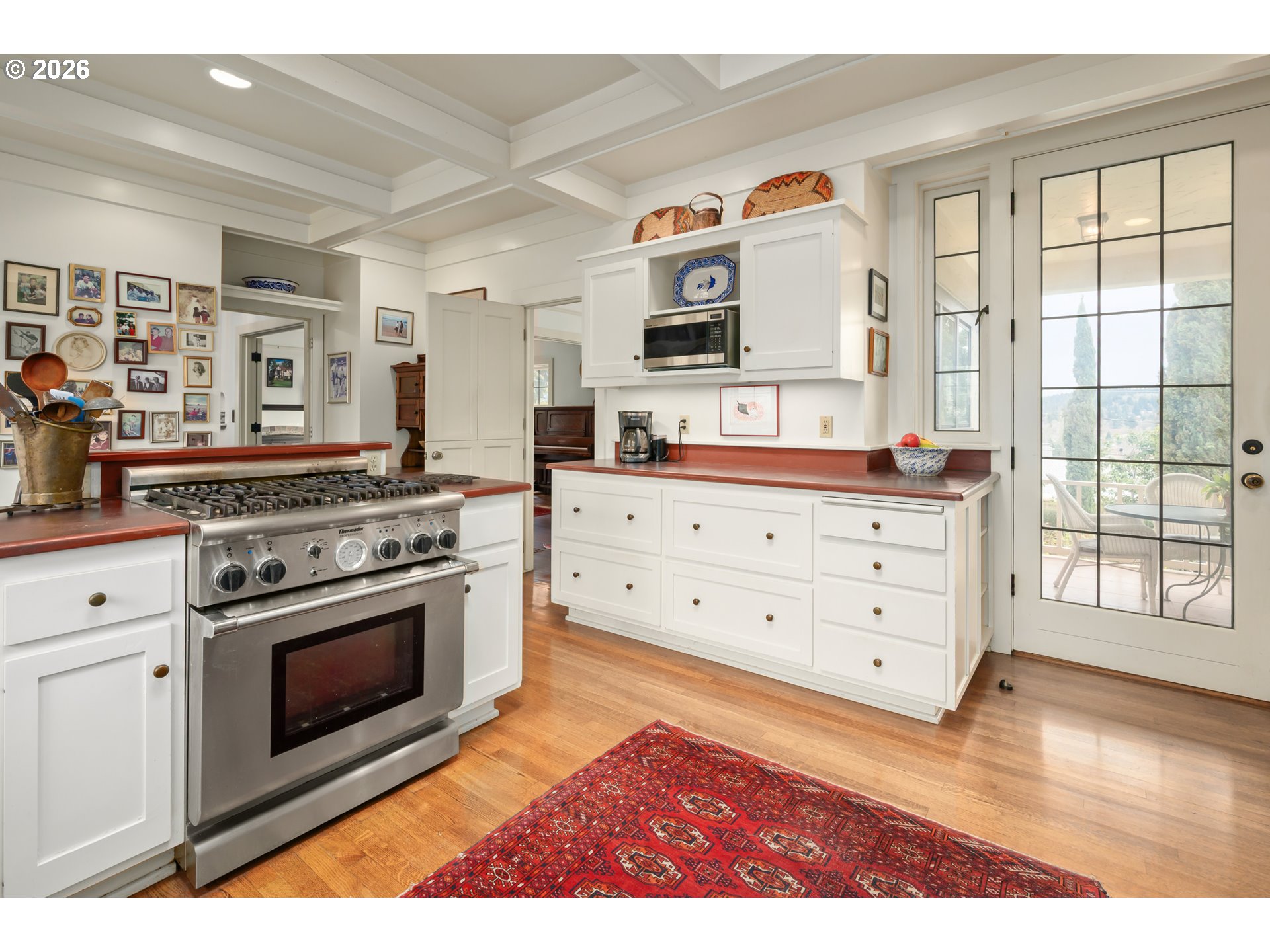 2223 Olive Street Eugene, OR 97405 - Photo 10 of 44 a kitchen with stainless steel appliances granite countertop a stove a sink and a microwave