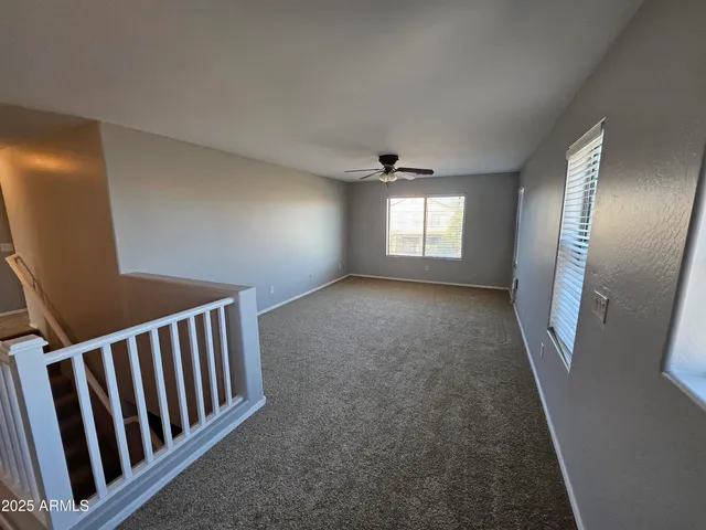 a view of hallway with windows