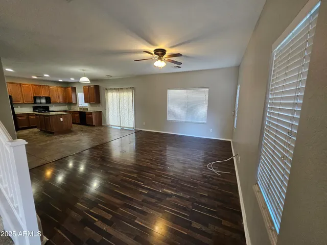 a view of kitchen and dining room with wooden floor