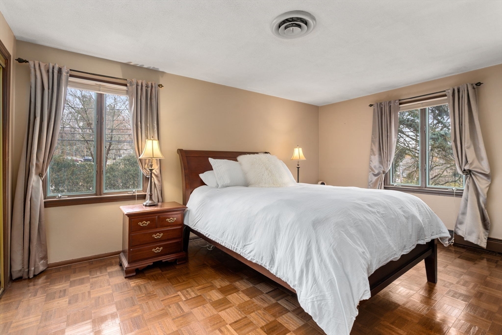 1640 Commonwealth Avenue Newton, MA 02465 - Photo 13 of 27 a bedroom with a bed and a large window