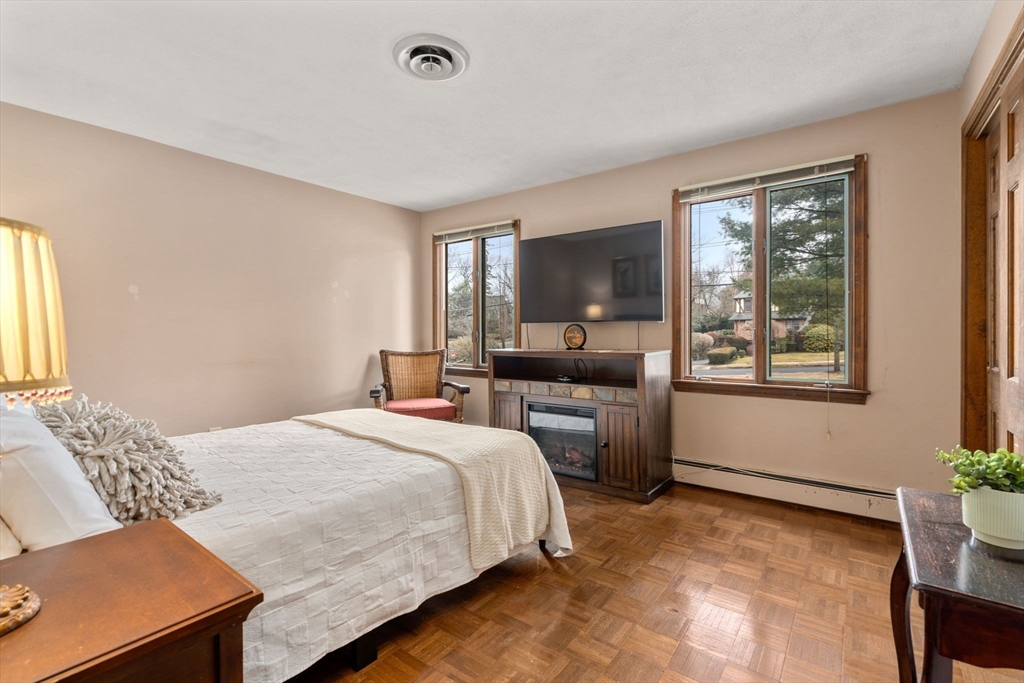 1640 Commonwealth Avenue Newton, MA 02465 - Photo 15 of 27 a bedroom with a bed and a couch