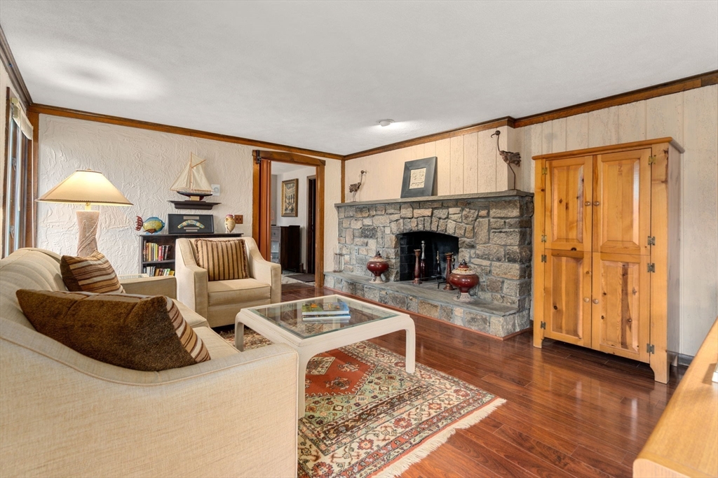 1640 Commonwealth Avenue Newton, MA 02465 - Photo 17 of 27 a living room with furniture and a fireplace