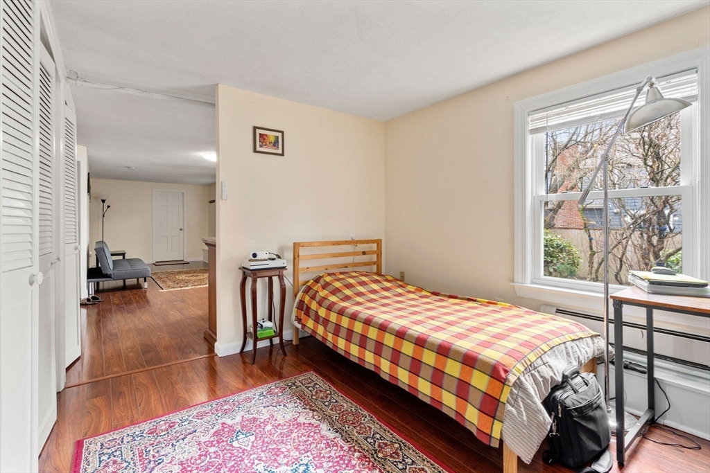 1640 Commonwealth Avenue Newton, MA 02465 - Photo 20 of 27 a bedroom with a bed and a large window
