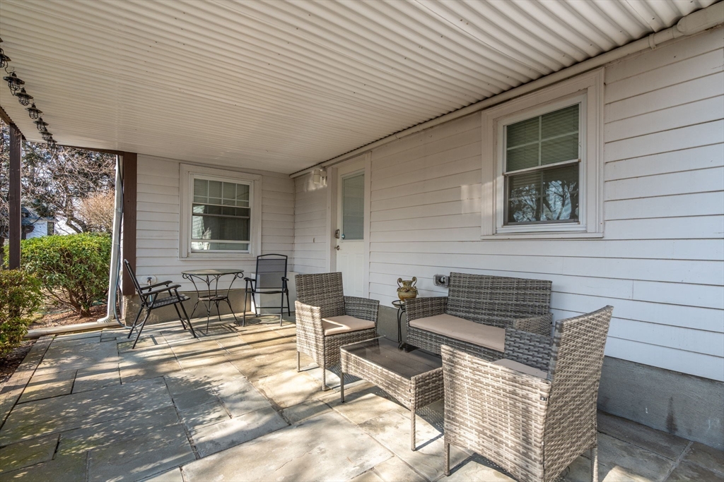 1640 Commonwealth Avenue Newton, MA 02465 - Photo 22 of 27 a building outdoor space with patio furniture and potted plants