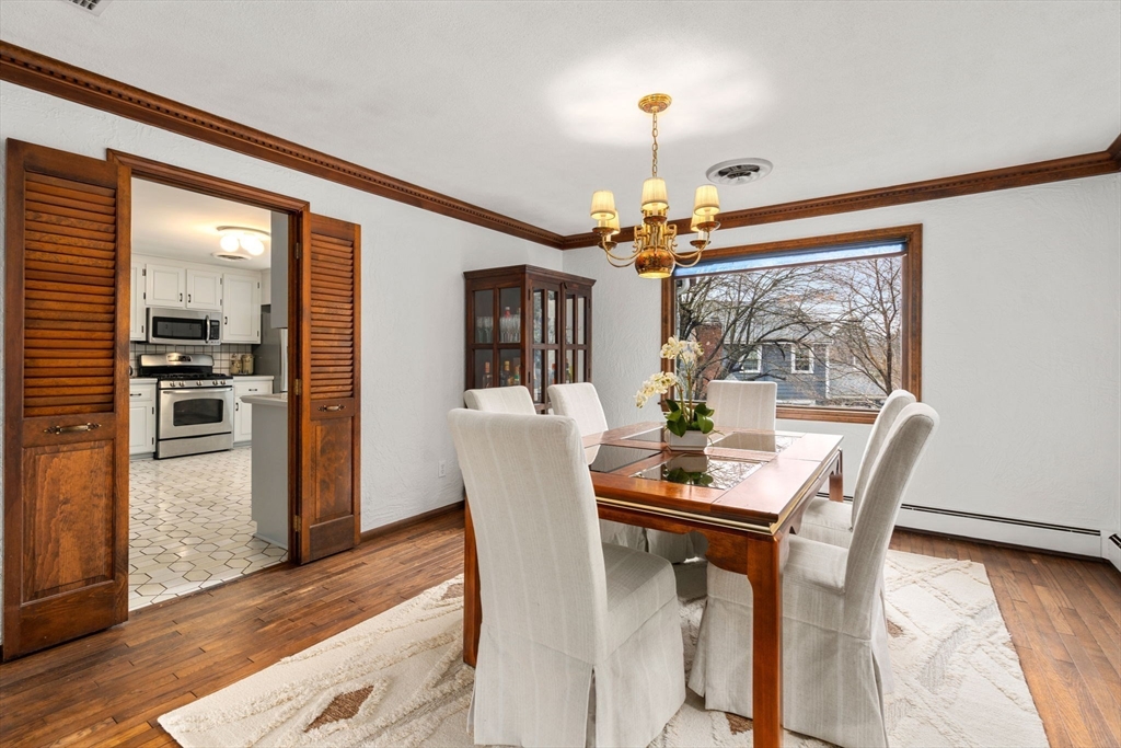 1640 Commonwealth Avenue Newton, MA 02465 - Photo 9 of 27 a view of a dining room with furniture and wooden floor