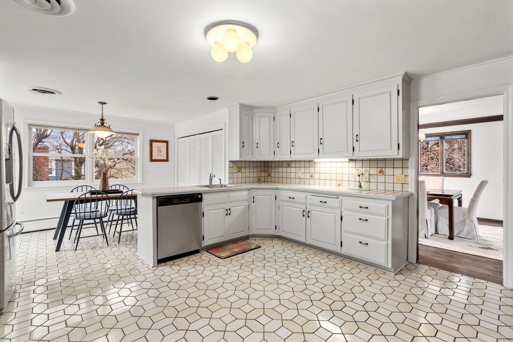 1640 Commonwealth Avenue Newton, MA 02465 - Photo 10 of 27 a kitchen with a cabinets and appliances