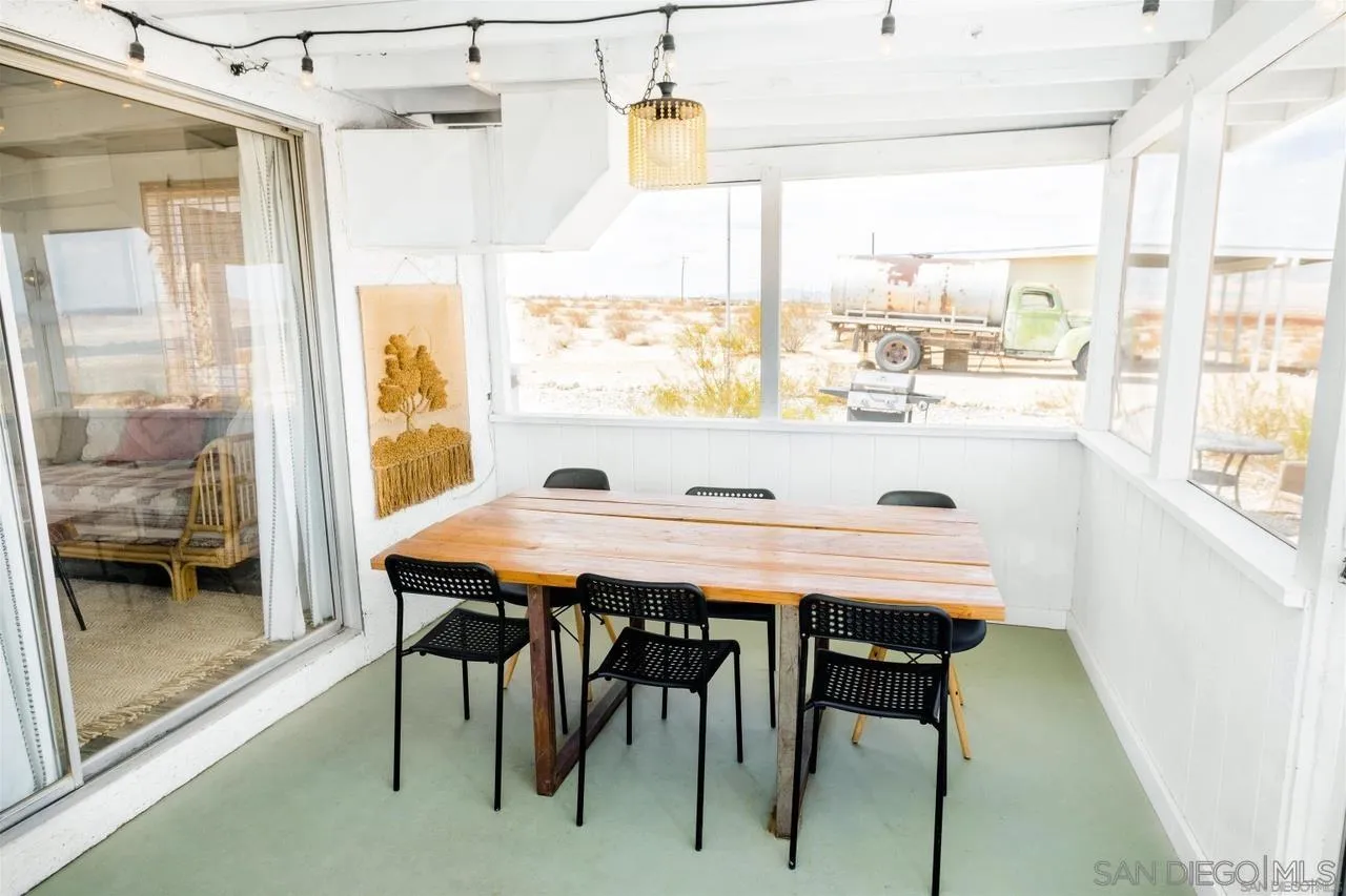 1195 Canyon Road Twentynine Palms, CA 92277 - Photo 16 of 26 a view of a dining room with furniture window and outside view