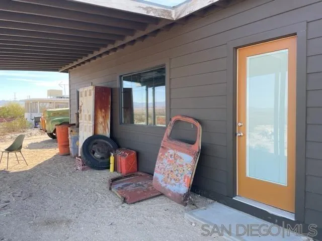 1195 Canyon Road Twentynine Palms, CA 92277 - Photo 23 of 26 a room with furniture and a chandelier
