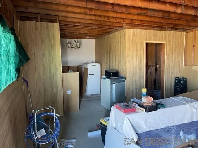 1195 Canyon Road Twentynine Palms, CA 92277 - Photo 24 of 26 a bedroom with bed and a mirror