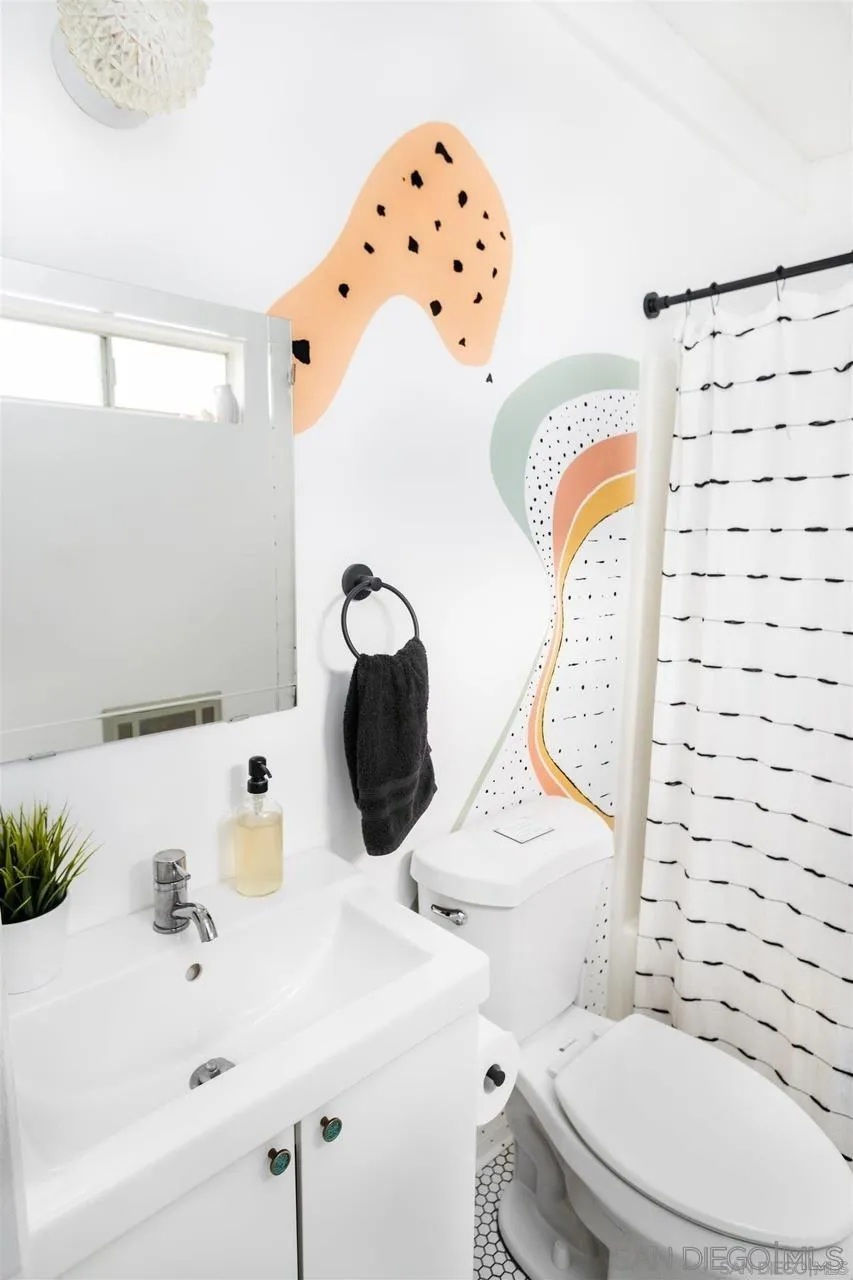 1195 Canyon Road Twentynine Palms, CA 92277 - Photo 9 of 26 a bathroom with a sink toilet and mirror