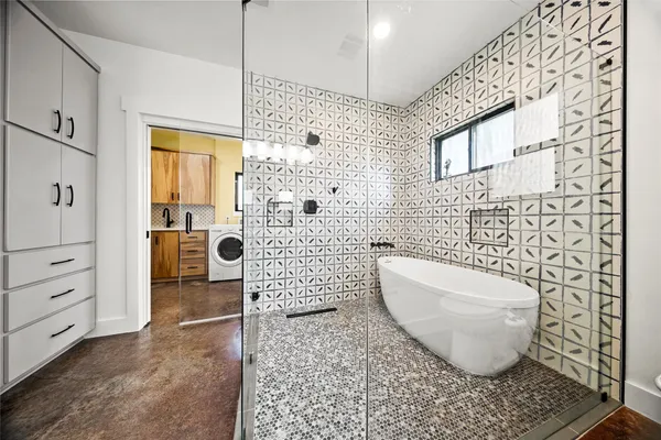 a bathroom with a toilet and a shower