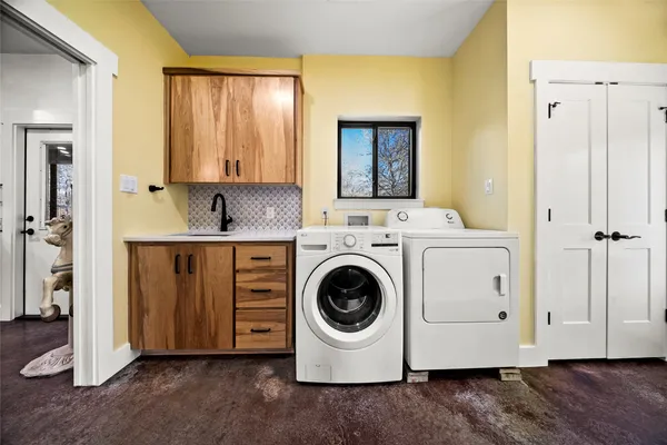 a utility room with dryer and washer