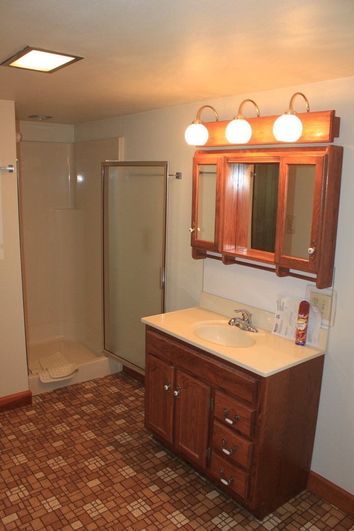 18918 Fairhaven Road Chadwick, IL 61014 - Photo 7 of 18 a bathroom with a sink and a mirror