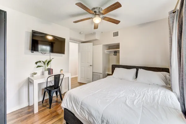 an aerial view of a house with a yard and sitting area