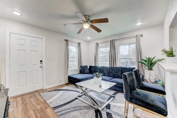 a living room with furniture and a window
