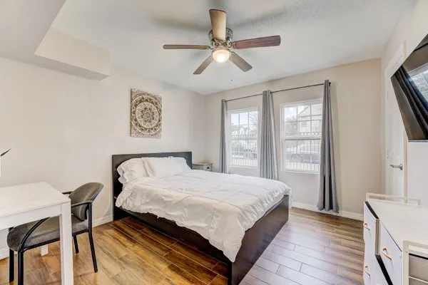 a bedroom with a bed and a table in it