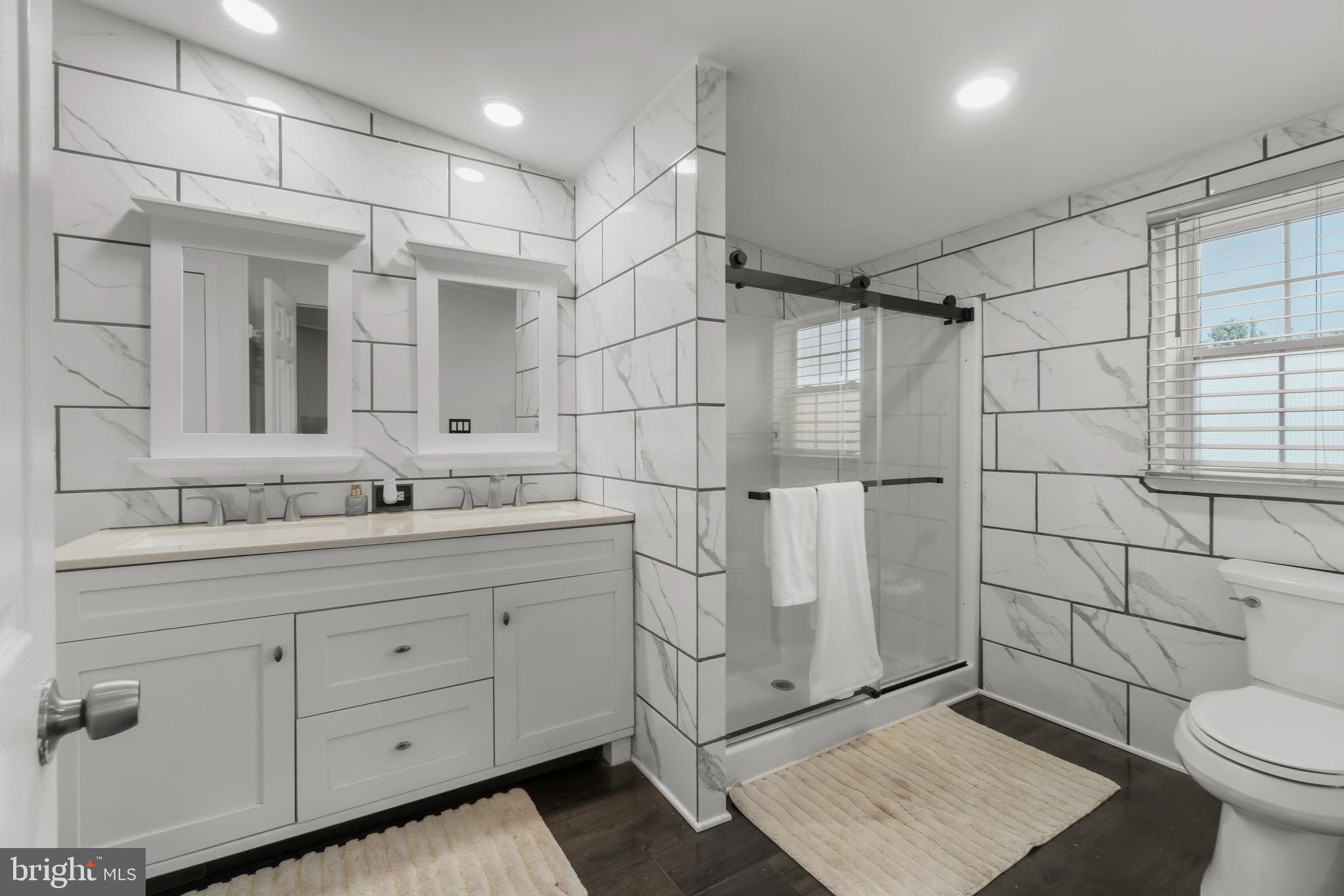 151 Robin Drive West Deptford, NJ 08066 - Photo 13 of 17 a bathroom with a sink toilet and shower