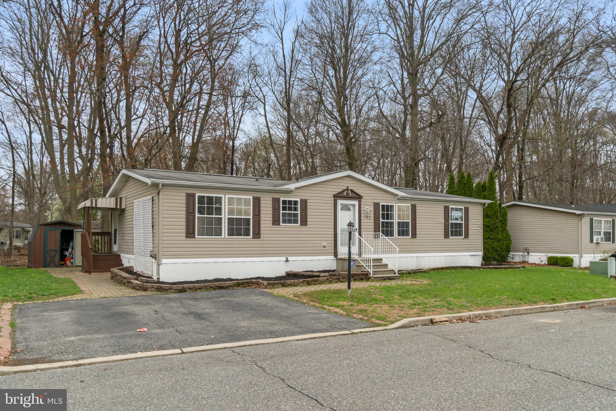 151 Robin Drive West Deptford, NJ 08066 - Photo 2 of 17 a front view of a house with a yard and garage