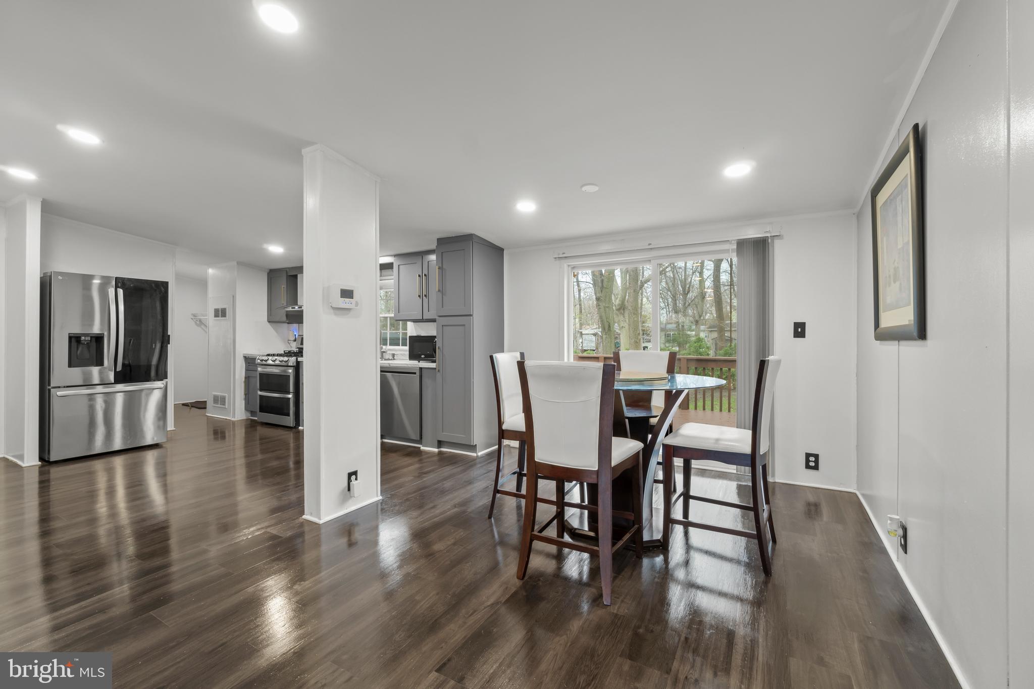 151 Robin Drive West Deptford, NJ 08066 - Photo 5 of 17 a view of a dining room with furniture and wooden floor