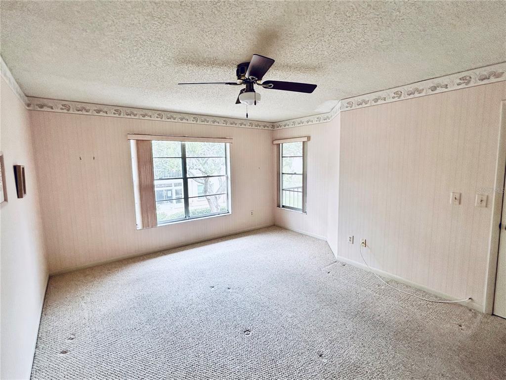4826 Myrtle Oak Drive, Unit 23 New Port Richey, FL 34653 - Photo 12 of 42 a view of an empty room with a window