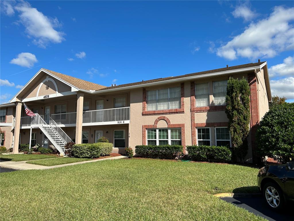 4826 Myrtle Oak Drive, Unit 23 New Port Richey, FL 34653 - Photo 20 of 42 a front view of a house with garden