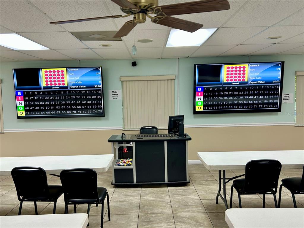 4826 Myrtle Oak Drive, Unit 23 New Port Richey, FL 34653 - Photo 27 of 42 a view of a dining room with furniture and a flat screen tv
