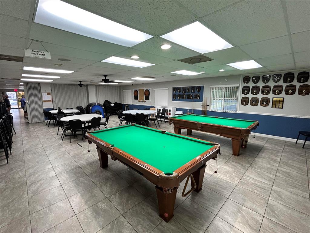 4826 Myrtle Oak Drive, Unit 23 New Port Richey, FL 34653 - Photo 29 of 42 a room with pool table and chairs