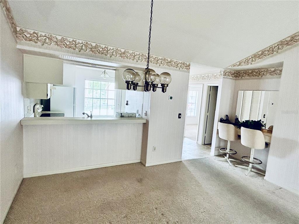 4826 Myrtle Oak Drive, Unit 23 New Port Richey, FL 34653 - Photo 6 of 42 a view of a kitchen with kitchen appliances and a window