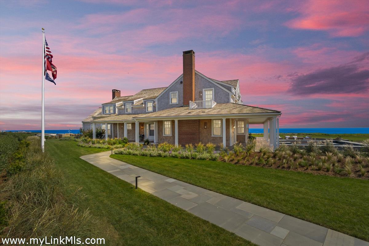 37 Sankaty Head Road Nantucket, MA 02554 - Photo 6 of 65 a front view of a house with a garden