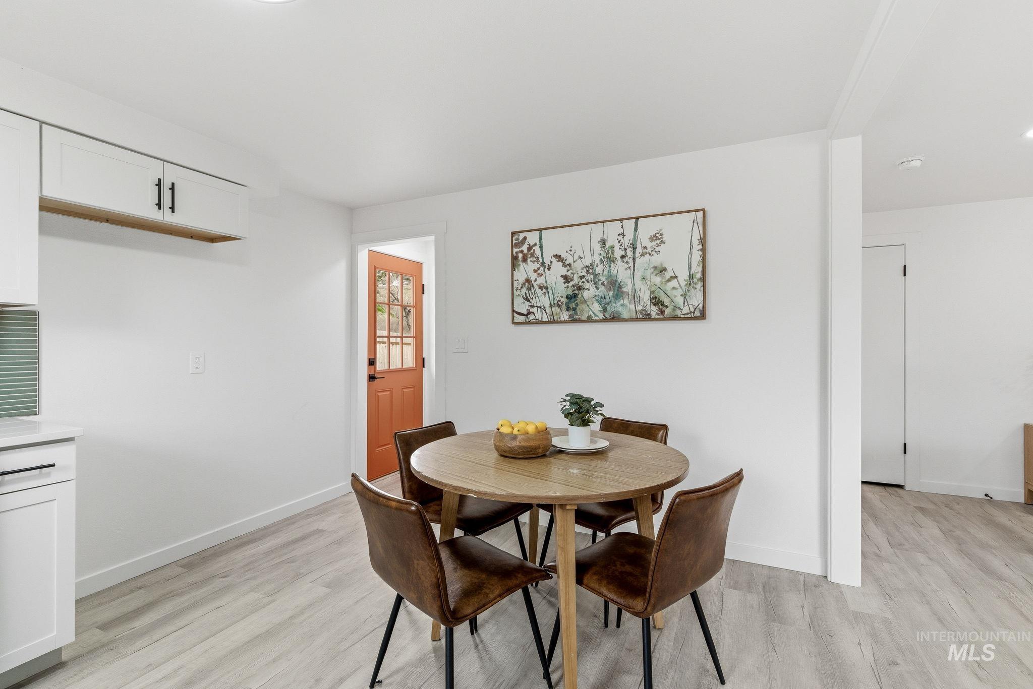 6123 South Brian Way Boise, ID 83716 - Photo 20 of 50 Dining space featuring light wood-style flooring and baseboards