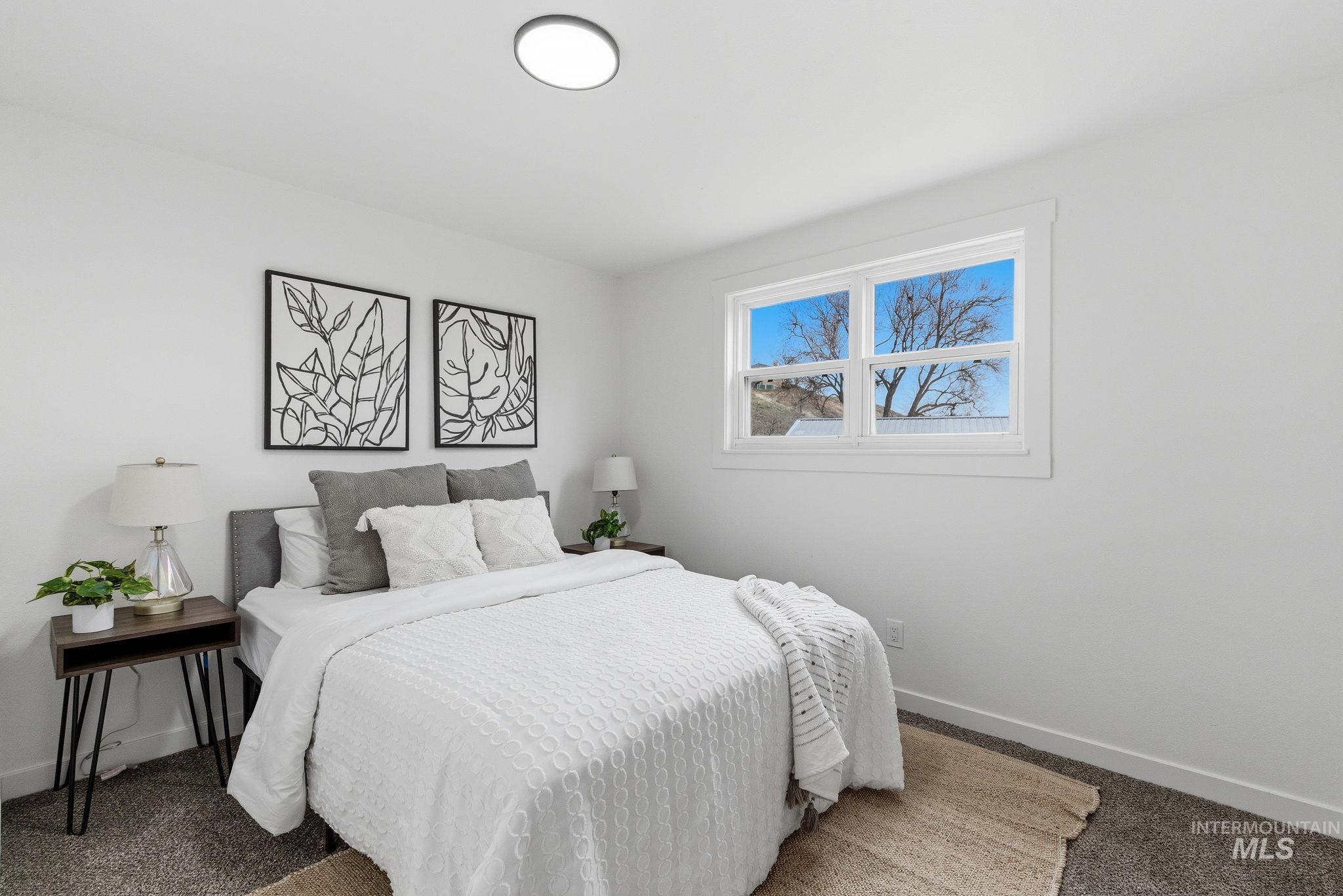 6123 South Brian Way Boise, ID 83716 - Photo 22 of 50 Carpeted bedroom with baseboards
