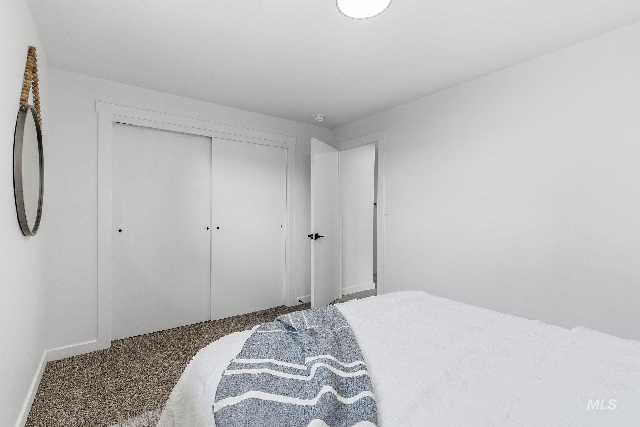 6123 South Brian Way Boise, ID 83716 - Photo 25 of 50 Bedroom featuring carpet and a closet