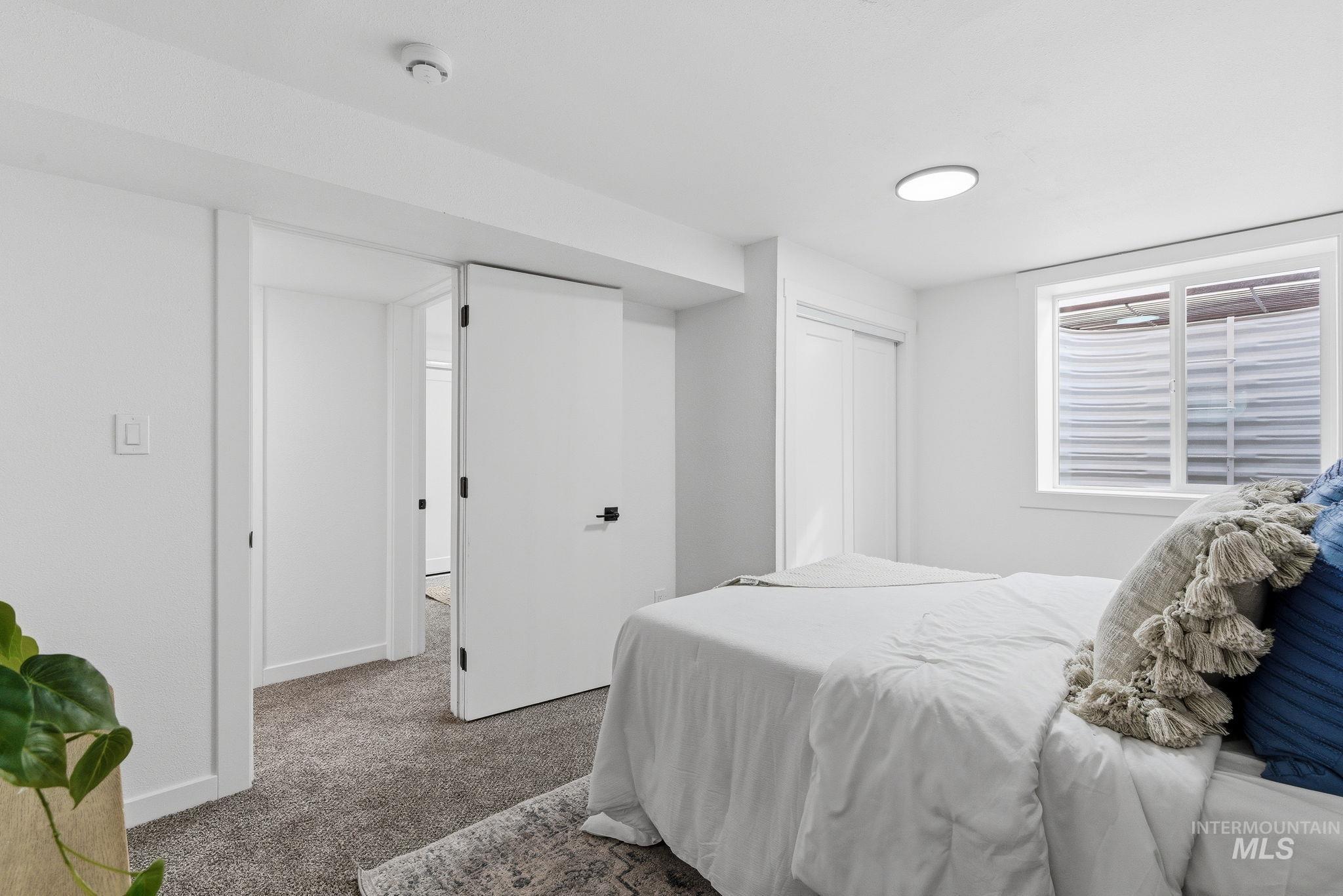 6123 South Brian Way Boise, ID 83716 - Photo 29 of 50 Carpeted bedroom featuring a closet and baseboards