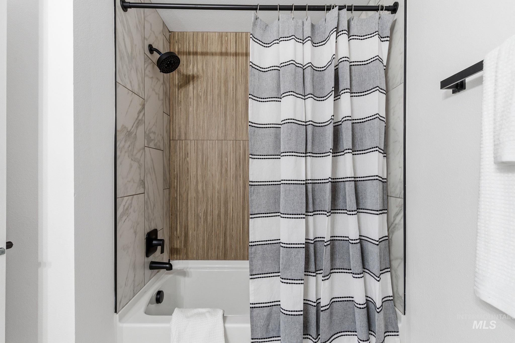 6123 South Brian Way Boise, ID 83716 - Photo 32 of 50 Bathroom featuring shower / bathtub combination with curtain