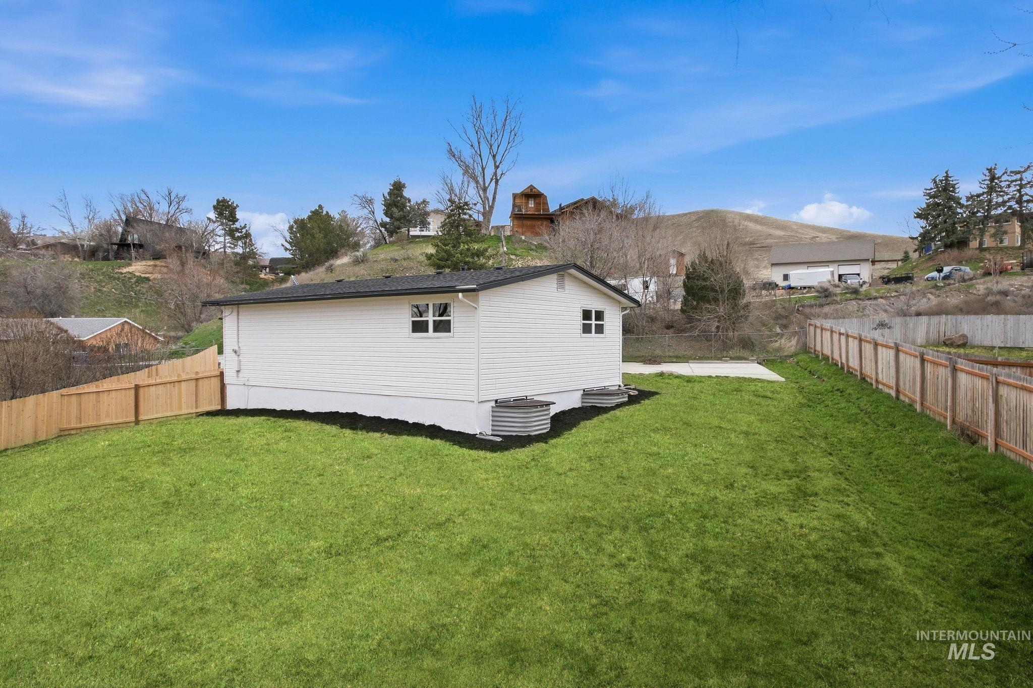 6123 South Brian Way Boise, ID 83716 - Photo 44 of 50 Back of house with a fenced backyard