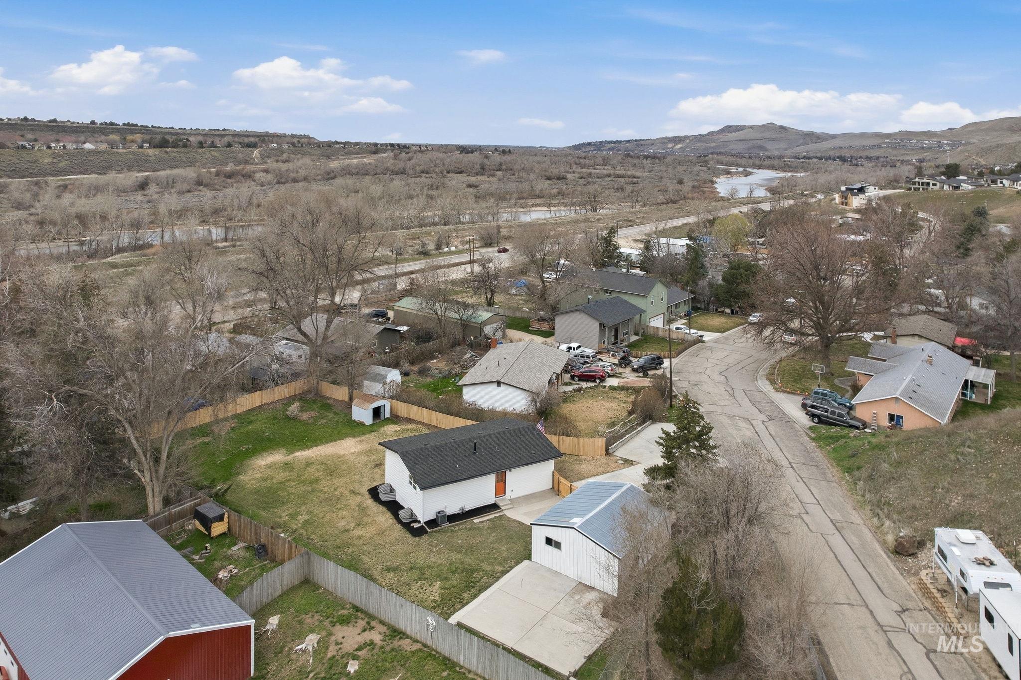 6123 South Brian Way Boise, ID 83716 - Photo 49 of 50 Aerial perspective of suburban area featuring a mountainous background