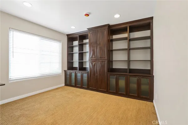 a big room with closet and windows